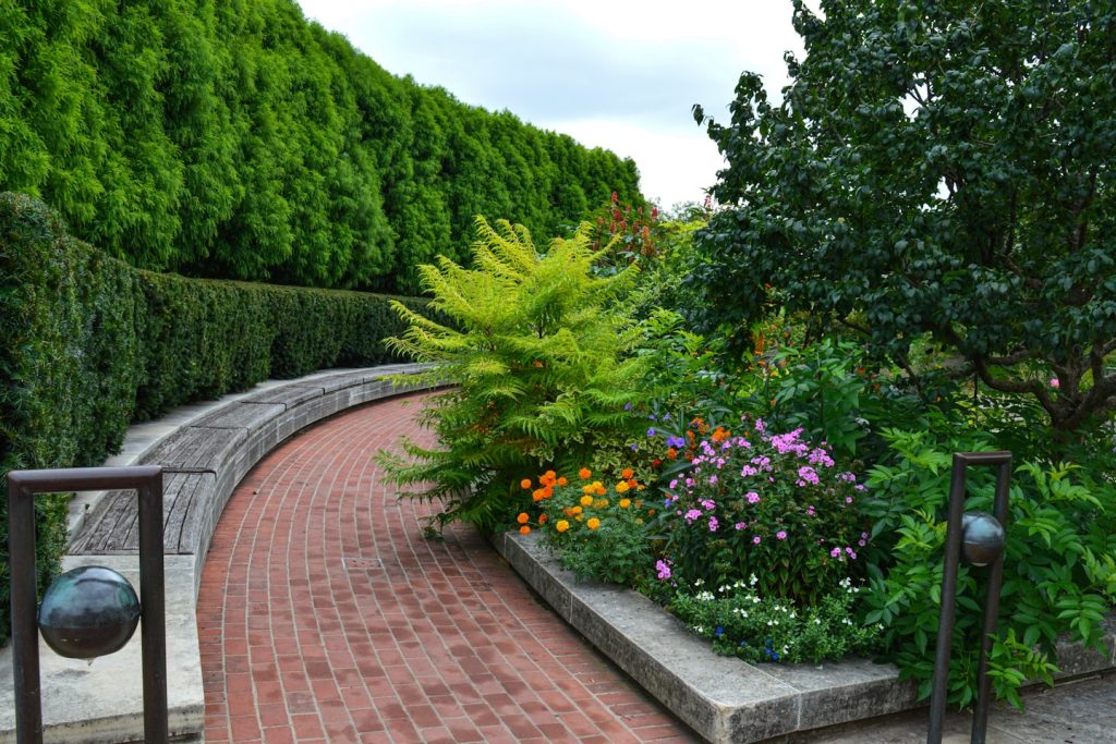 Brick paver walkway with flower bed