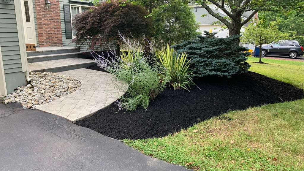 Landscaped bed with paver path