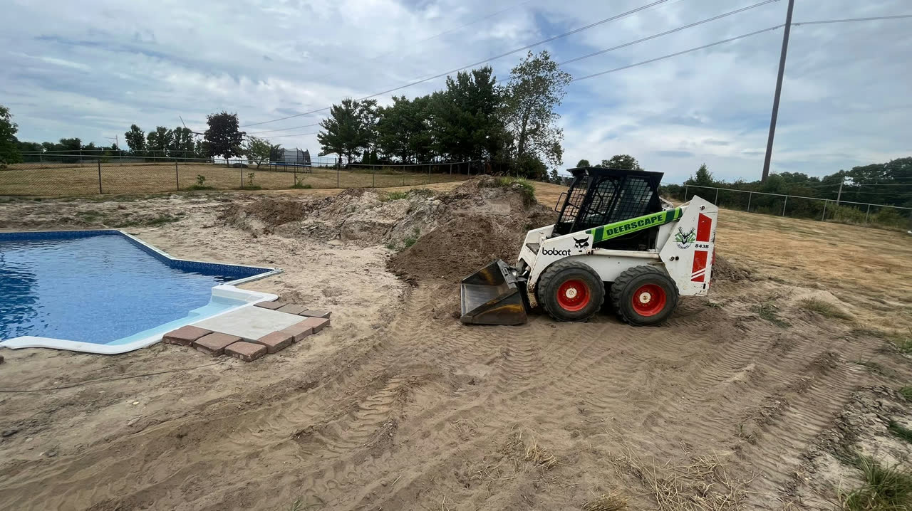 Pool site preparation with skid steer